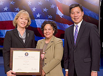 NIST researcher Barbara Lippiatt (left) received the 2010 GreenGov Presidential Award for her work on a software tool that measures the environmental performance of building materials and biologically based products. She is pictured with Nancy Sutley, Chair, White House Council on Environmental Quality Christopher Lu, Assistant to the President and Cabinet Secretary, Office of Cabinet Affairs. Credit: Eric Vance, US Environmental Protection Agency