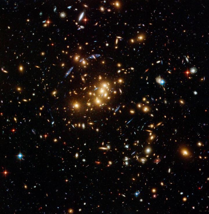 CAPTION This is an image of a galaxy cluster, which may contain hundreds or thousands of galaxies bound gravitationally.