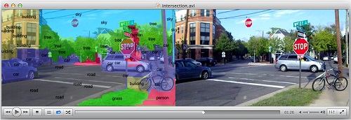 Researchers are working to enable smartphones and other mobile devices to understand and immediately identify objects in a camera's field of view, overlaying lines of text that describe items in the environment. Here, a street scene is labeled by the prototype, running up to 120 times faster than a conventional cell-phone processor