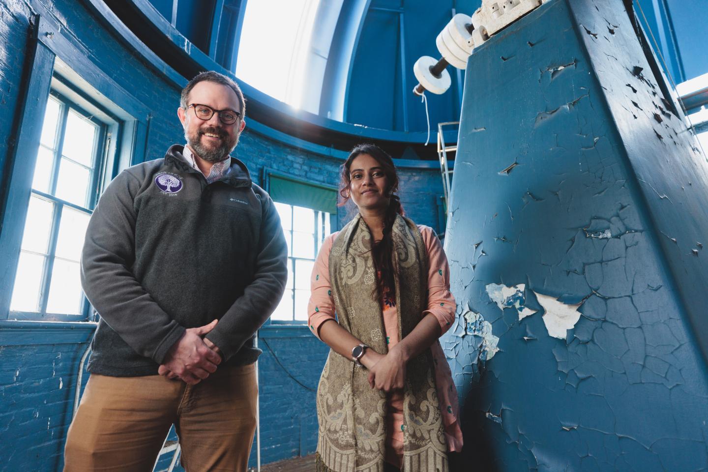 Tonima Tasnim Ananna, postdoctoral research associate, at right, and Ryan Hickox, professor of physics and astronomy, in Dartmouth’s historic Shattuck Observatory. (Photo by Robert Gill)