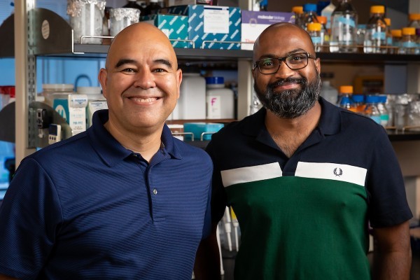 Windsor Aguirre, associate professor of evolutionary biology, and Thiru Ramaraj, assistant professor in the School of Computing, earned a University Research Council collaboration grant to fund their computational biology project. (DePaul University/Jeff Carrion)