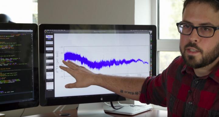 CAPTION Joshua Garland examines isotopic data from the West Antarctic Ice Sheet.  CREDIT Bryan Rogala/Mountain Standard Creative for the Santa Fe Institute