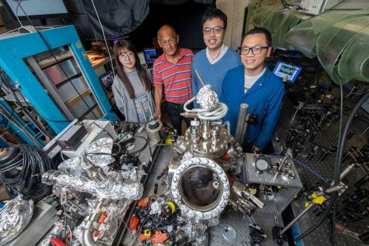 The UCI team responsible for the assembly and use of the terahertz laser-equipped scanning tunneling microscope pictured here are, from left to right, Dan Bai, UCI Ph.D. student in physics & astronomy; Wilson Ho, Bren Professor of physics & astronomy and chemistry; Yunpeng Xia, Ph.D. student in physics & astronomy; and Likun Wang and Ph.D. candidate in chemistry. Steve Zylius / UCI