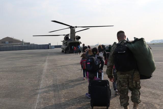 CAPTION Family members representing installations and commands throughout US Forces Korea board a CH-47 Chinook Helicopter Daegu Air Base, Republic of Korea, Nov. 3, 2016, for noncombatant exercise Courageous Channel.  CREDIT (Photo Credit: Staff Sgt. Joseph Moore)