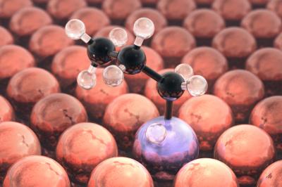 Artistic rendering of the propane dehydrogenation process taking place on the novel single atom alloy catalyst, as predicted by theory. The picture shows the transition state obtained from a quantum chemistry calculation on a supercomputer, i.e. the molecular configuration of maximum energy along the reaction path.  CREDIT Charles Sykes & Michail Stamatakis