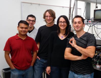 Members of the Vuckovic team in the lab from left to right: Arka Majumdar, Tomas Sarmiento, Jan Petykiewicz, Jelena Vuckovic, and Gary Shambat (holding the chip carrier).