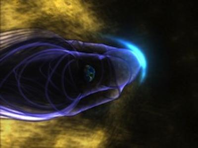 This is an artist's concept of the Earth's global magnetic field, with the bow shock. Earth is in the middle of the image, surrounded by its magnetic field, represented by purple lines. The bow shock is the blue crescent on the right. Many energetic particles in the solar wind, represented in gold, are deflected by Earth's magnetic shield. Credit: Walt Feimer (HTSI)/NASA/Goddard Space Flight Center Conceptual Image Lab