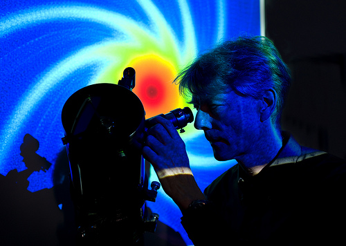 IBM scientist Ronald Luijten is working on exascale computers that can analyze exabytes of raw data in a five year collaboration with Astron, the Netherlands Institute for Radio Astronomy. The computers will analyze faint radio signals from deep space targeted for the Square Kilometre Array project. The graphic depicts the SKA sensitivity at a particular radio wave frequency.  Graphic credit: SKA Photo credit: IBM Research - Zurich