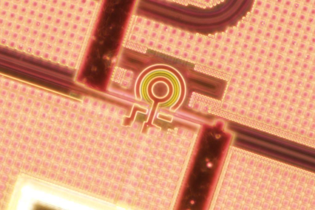  Photonic chip with a microring resonator nanofabricated in a commercial foundry. Photo credit: Joel Tasker, QET Labs 