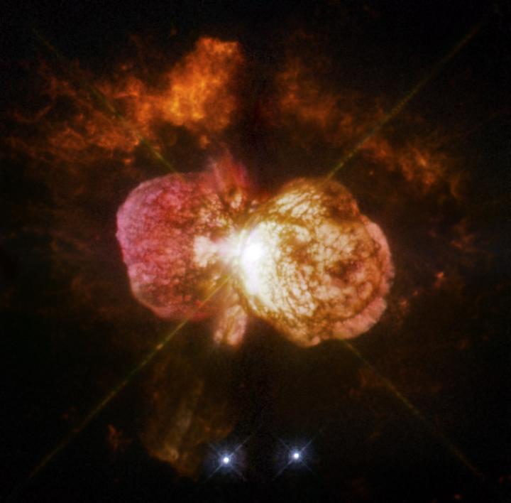 This is Eta Carinae's great eruption in the 1840s created the billowing Homunculus Nebula, imaged here by Hubble. Now about a light-year long, the expanding cloud contains enough material to make at least 10 copies of our sun. Astronomers cannot yet explain what caused this eruption.