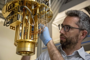 Professor John Morton next to a dilution fridge  CREDIT A. Abrusci / UCL