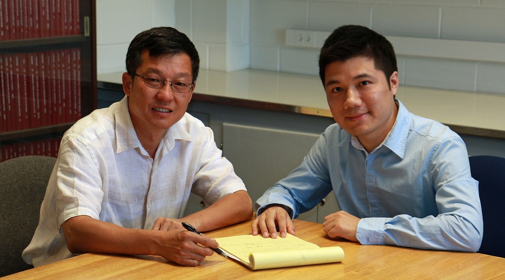 Feng Liu (left), chair of the University of Utah Department of Materials Science and Engineering, and Miao Zhou, a postdoctoral fellow, co-authored a study of a new “topological insulator” that could lead theoretically to faster computing.  Photo Credit: Dan Hixson, University of Utah College of Engineering