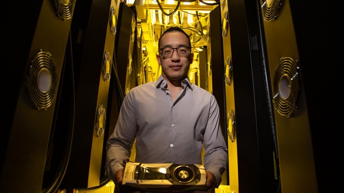 Gerald Quon with one of the graphics card he uses to build computer networks for his research. Quon uses computational models to understand the relationship between genetics and cellular behavior that can lead to schizophrenia or bipolar disorder.