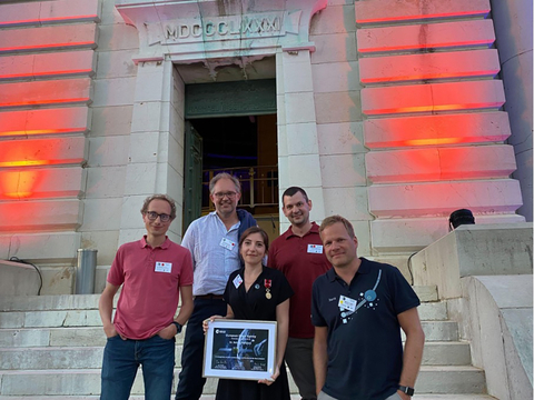 Sabina Raducan (center) and Martin Jutzi (right) with collaborators at the Hera Workshop in Nice, France. © Dr. Toshi Hirabayashi