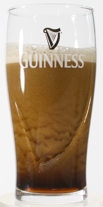 Bubble texture of Guinness beer in a pint glass, featuring the creamy taste of tiny bubbles and fascinating texture motion