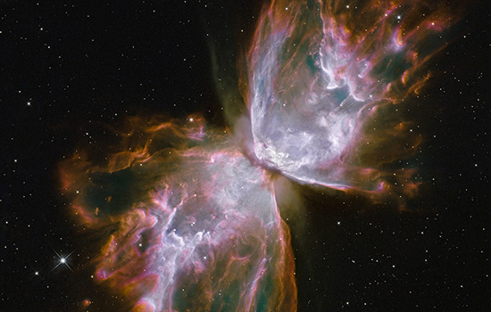 A dying star that was once about five times the mass of the sun is at the center of the Butterfly Nebula, pictured here, which is about 3,800 light-years away in the constellation Scorpius. The central star itself cannot be seen because it is hidden within a doughnut-shaped ring of dust.