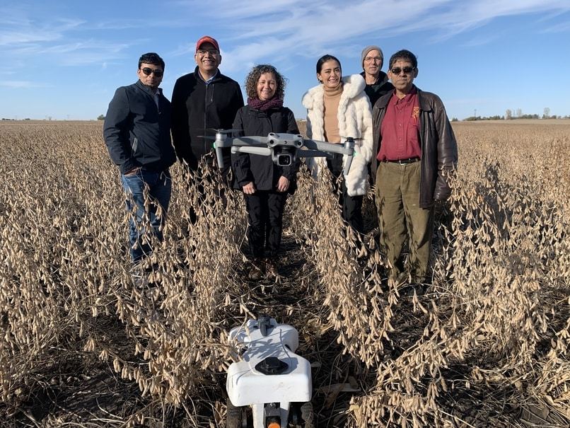 Missouri S&T is using drones in its collaborative research to help farm communities better communicate agricultural hazards such as pests, weeds and crop diseases. L-R: S&T postdoctoral researcher Ashish Gupta; Asheesh Singh, Iowa State University; Corinne Valdovia and Michelle Segovia, University of Missouri-Columbia; S&T Ph.D. student Kevin Menke and his advisor, Sajal Das. Photo provided by Das.