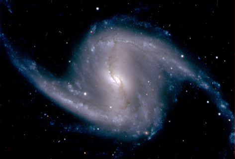 Zoomed-in image from the Dark Energy Camera of the barred spiral galaxy NGC 1365, in the Fornax cluster of galaxies, which lies about 60 million light years from Earth. Credit: Dark Energy Survey Collaboration.