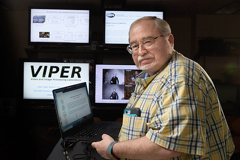 Edward Delp, the Charles William Harrison Distinguished Professor of Electrical and Computer Engineering and director of the Video and Imaging Processing Laboratory at Purdue University, is leading a team of experts for the U.S. Department of Defense researching ways to detect several forms of manipulated media. (Purdue University photo/John Underwood)