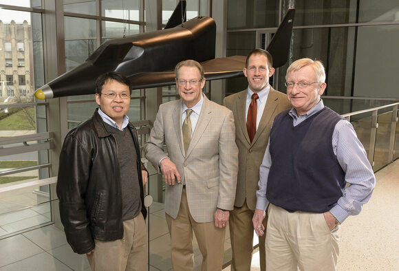 The multistate Institute for Advanced Composites Manufacturing Innovation (IACMI) includes the Indiana-based Design, Modeling & Simulation Enabling Technology Center, which is led by R. Byron Pipes, the John Leighton Bray Distinguished Professor of Engineering at Purdue, along with a consortium of university researchers, manufacturers, national laboratories, and state and local government agencies. Team leaders at Purdue, from left, are Wenbin Yu, associate professor of aeronautics and astronautics; Pipes; Johnathan Goodsell, visiting assistant professor of aeronautics and astronautics; and Ronald Steuterman, the center’s managing director. (Purdue University photo/John Underwood) 