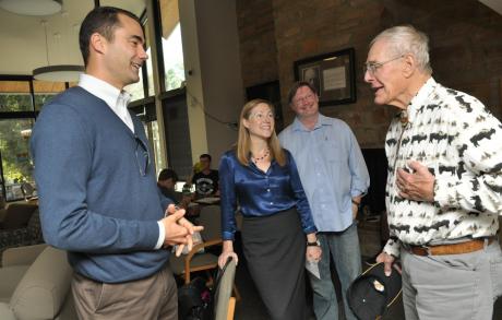 CU engineering alumni Jim Hansen (AeroEngr'92, MS '93) and Clancy Herbst (ChemEngr'50) greet each other as faculty members Diane Sieber and Scot Douglass look on at Andrews Hall. 