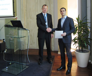 Professor Richard Kenway, chairman of the PRACE scientific steering committee presenting the award for most innovative HPC application in Europe to Hicham Lahlou, CEO of Xcelerit.